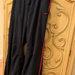 Nike black athletic pants with a red stripe size large